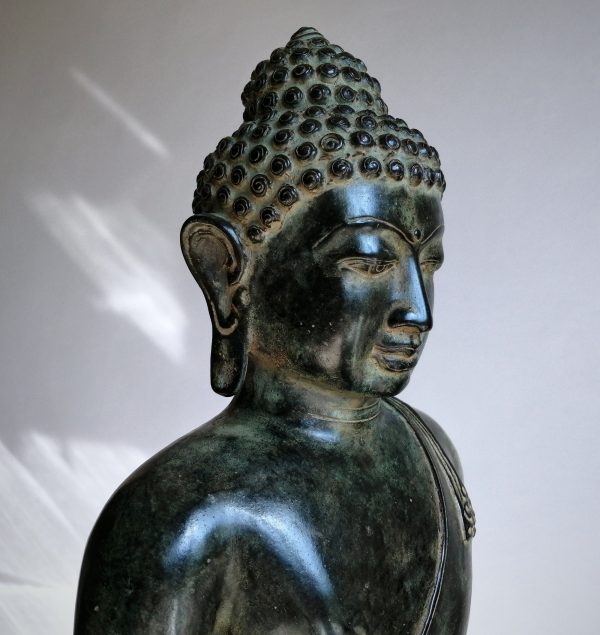 Large Buddha statue sitting in meditation