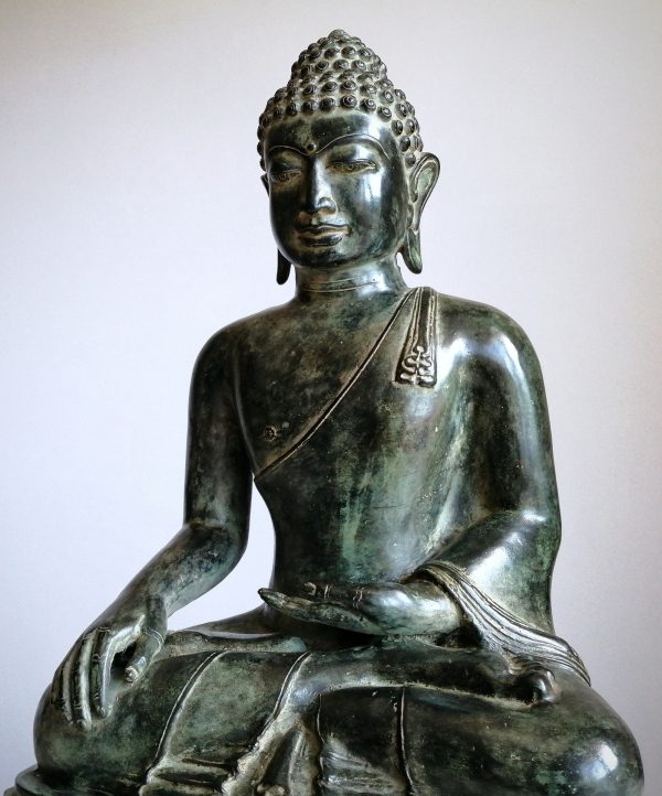 Large Buddha statue sitting in meditation